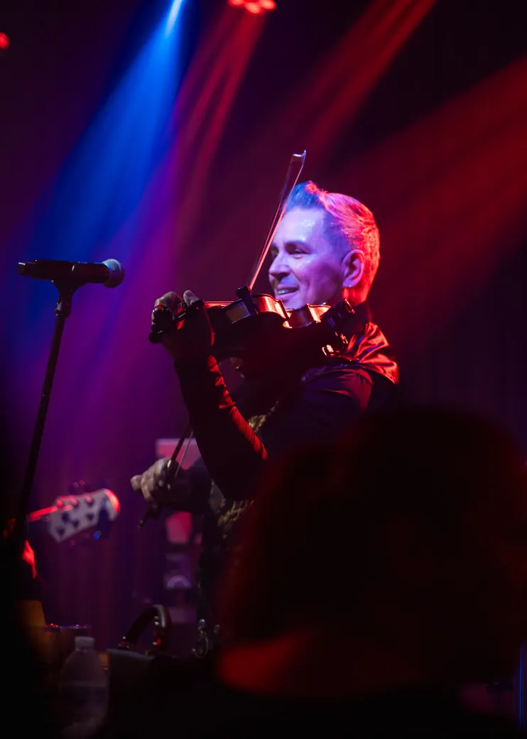 Abraham playing violin on stage