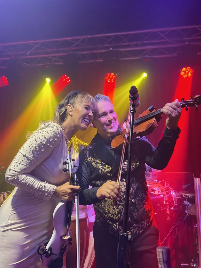 Tania and Abraham playing together on stage